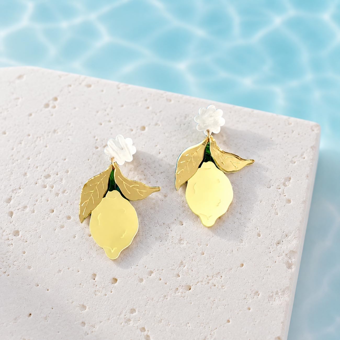 Yellow Lemon Acrylic Dangle Earrings with Gold Tone Leaves | White flower tops, gold tone leaves and yellow lemon drops; playful summer style for birthdays, vacations and daily outfits