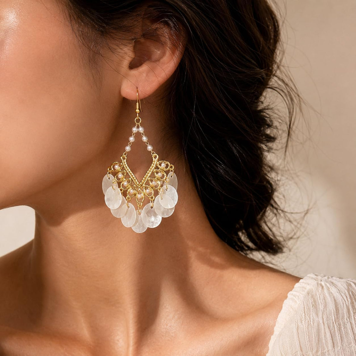 Boho Pearl Shell Dangle Earrings for Women, Gold Chandelier Drop Earrings | Lightweight statement earrings with white shell disc fringe, ideal for summer beach vacations, bohemian outfits and gifting.
