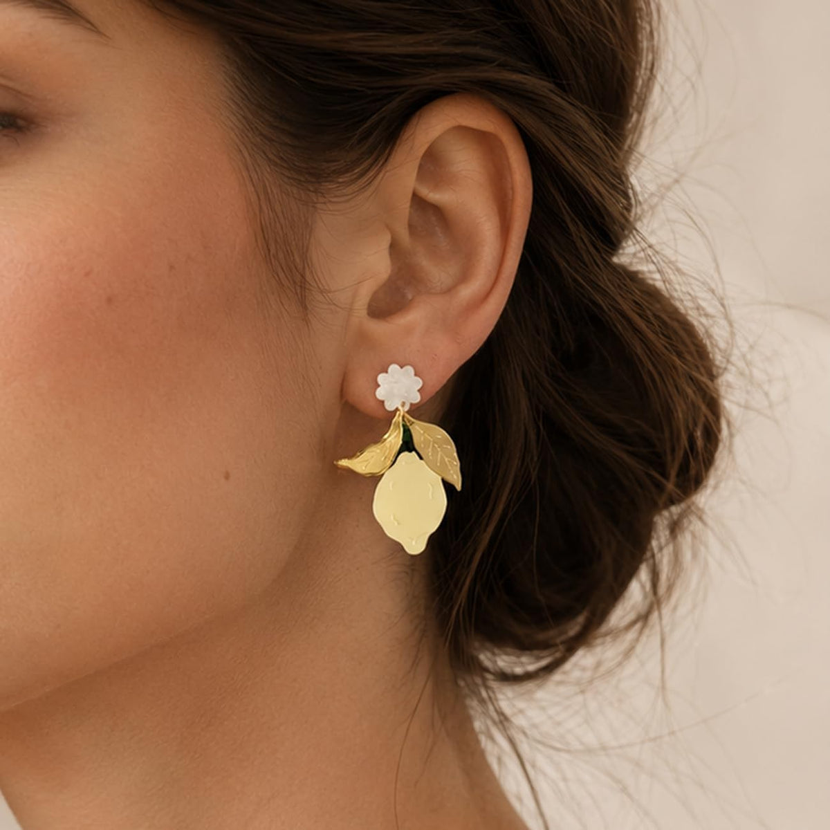 Yellow Lemon Acrylic Dangle Earrings with Gold Tone Leaves | White flower tops, gold tone leaves and yellow lemon drops; playful summer style for birthdays, vacations and daily outfits