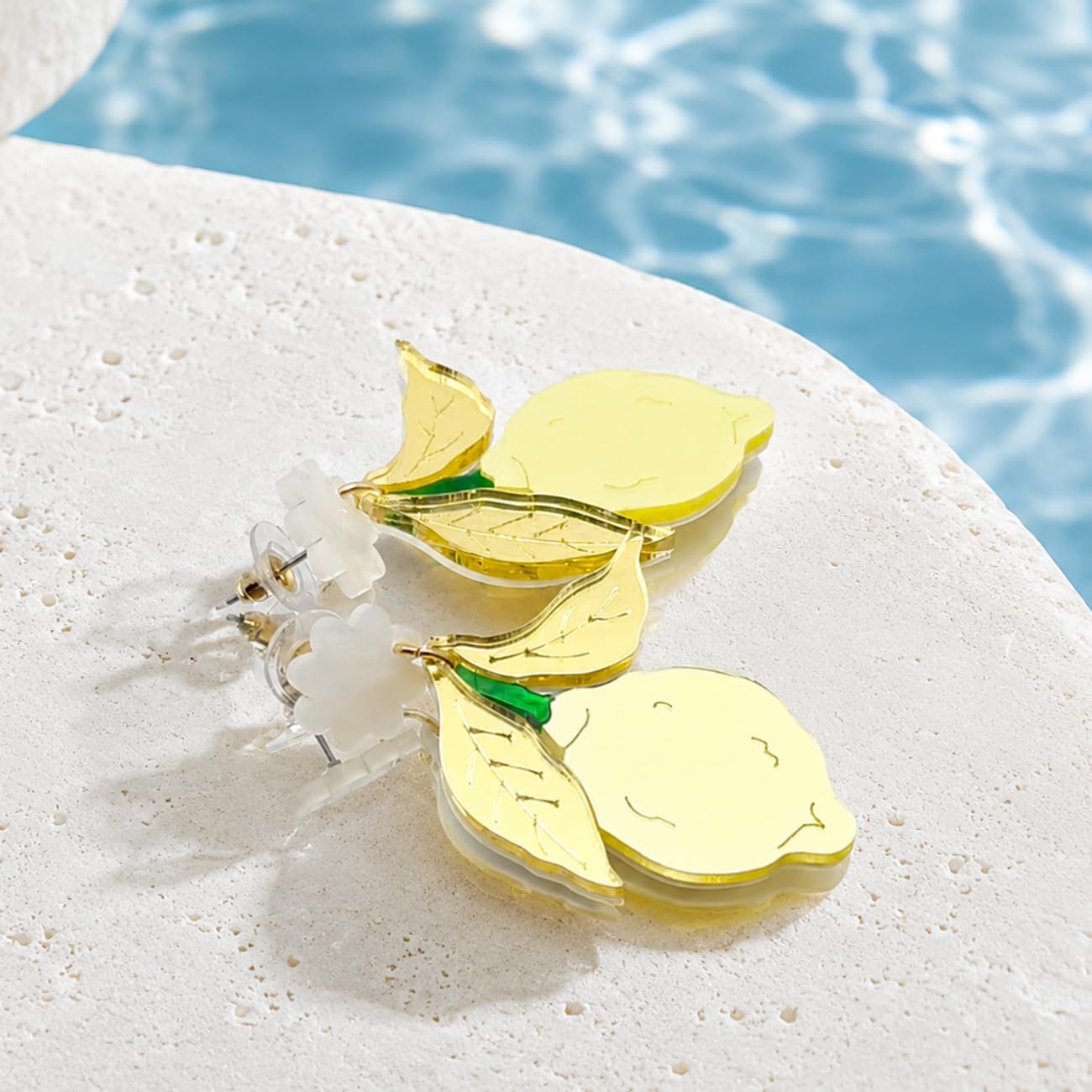 Yellow Lemon Acrylic Dangle Earrings with Gold Tone Leaves | White flower tops, gold tone leaves and yellow lemon drops; playful summer style for birthdays, vacations and daily outfits